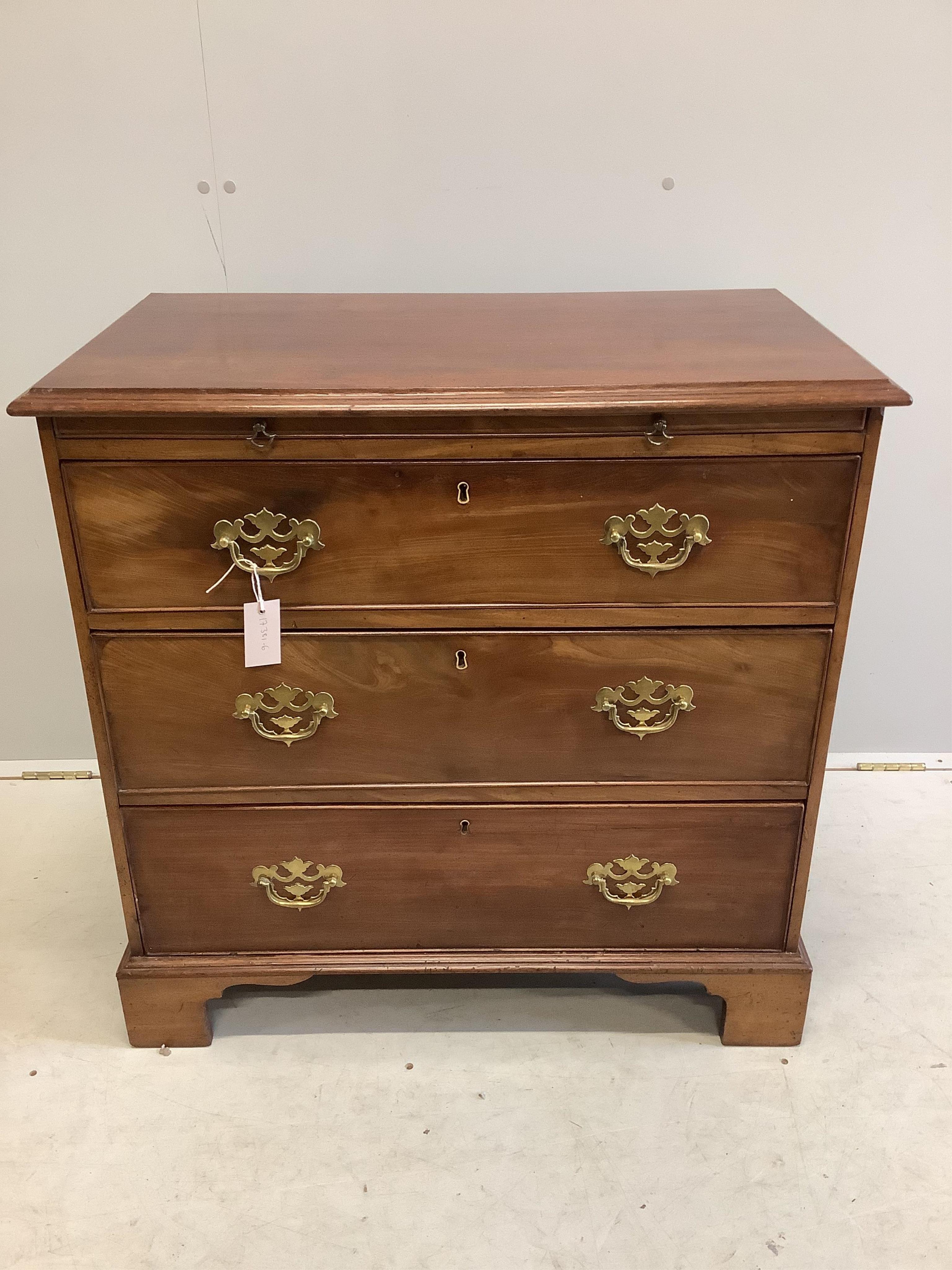 A small George III and later mahogany chest of drawers with a brushing slide, width 80cm, depth 45cm, height 79cm. Condition - fair